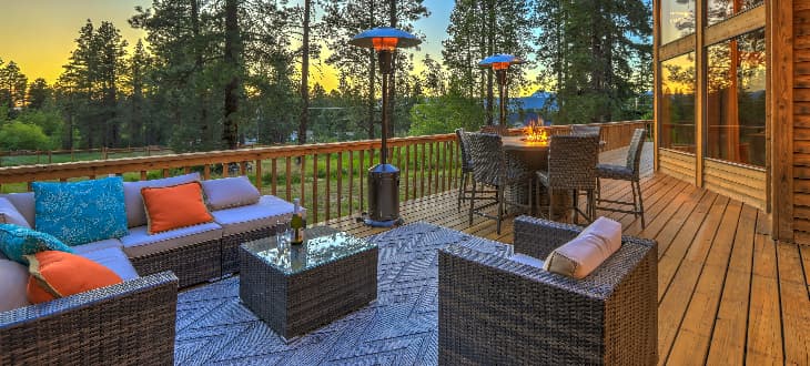 rug, chairs and accessories decorating garden decking