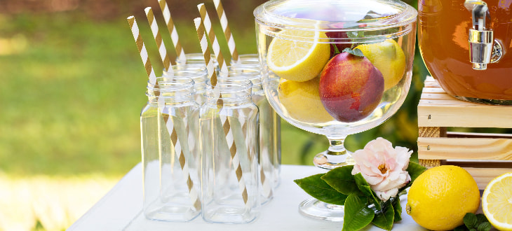 white bar in garden with drinks on it
