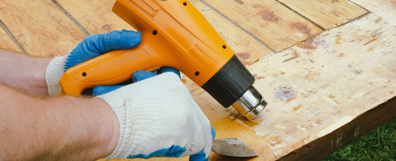 Someone using heat gun to repair composite decking