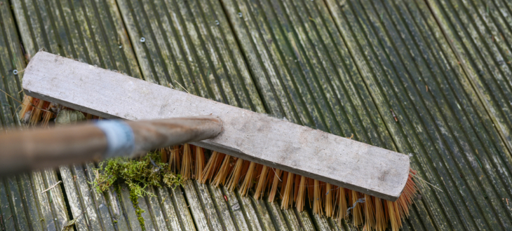 sweeping moss from decking