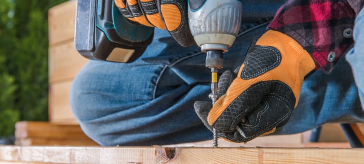 man repairing decking