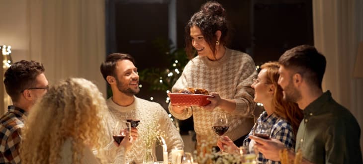 Friends eating christmas dinner