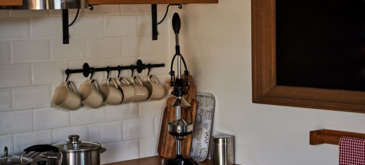 stylish organised kitchen with cabinet hooks