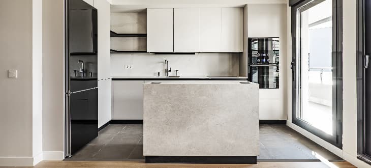minimalist kitchen with handleless cabinets and drawers