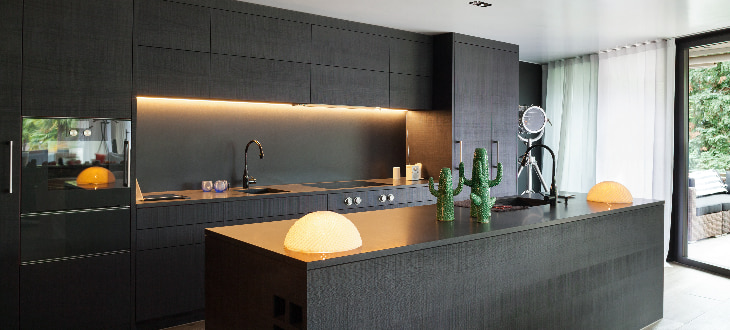 black kitchen worktops with unique lighting