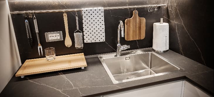 black kitchen worktop with accessories