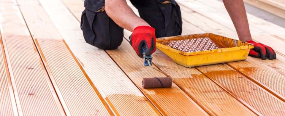 Man Staining New Decking