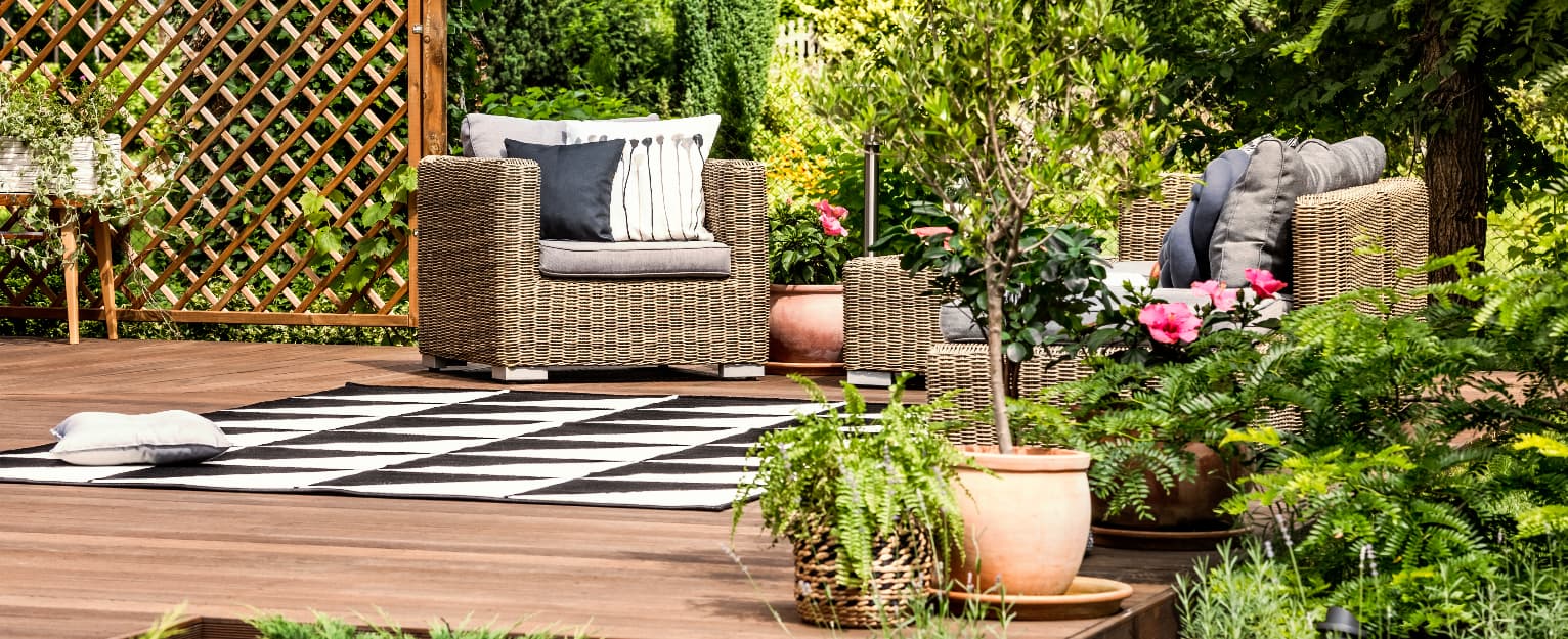 green garden with furniture and decking