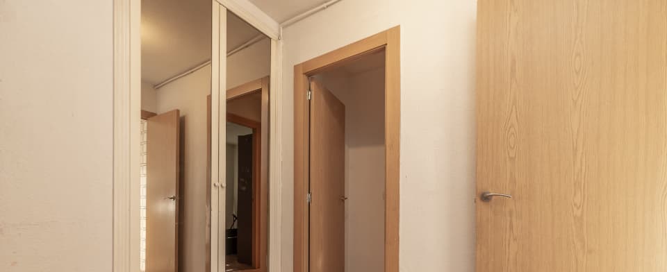 a room showing an oak wooden door