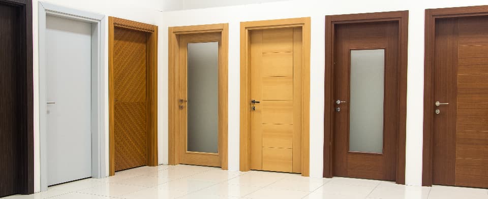 variety of wooden doors lined up