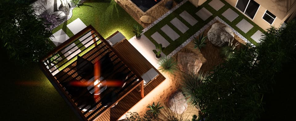 Aerial view of a modern landscaped garden with a pergola seating area, pathway and decorative plants at night
