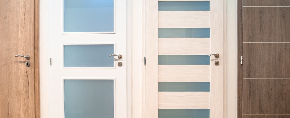 Selection of modern interior doors featuring wood finishes and frosted glass panel designs