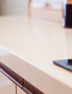 Close-up of a modern kitchen worktop with a sleek edge profile and integrated cabinetry detail